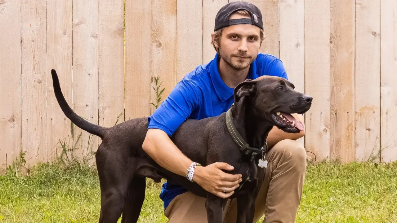 Caden Beegan, certified professional trainer, working with a dog at Beegan K9 Cleveland